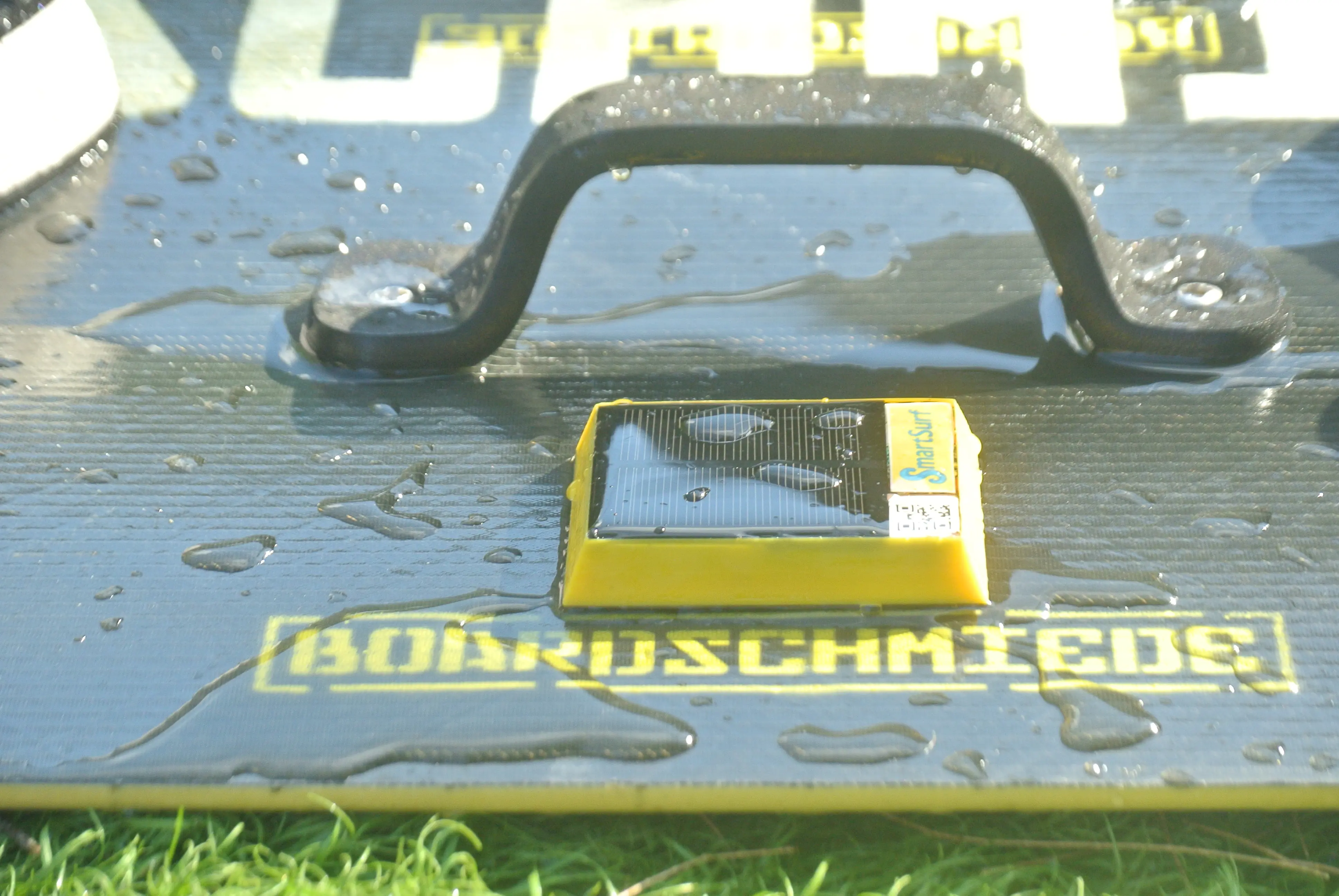 SmartSurf tracker on a wet kiteboard